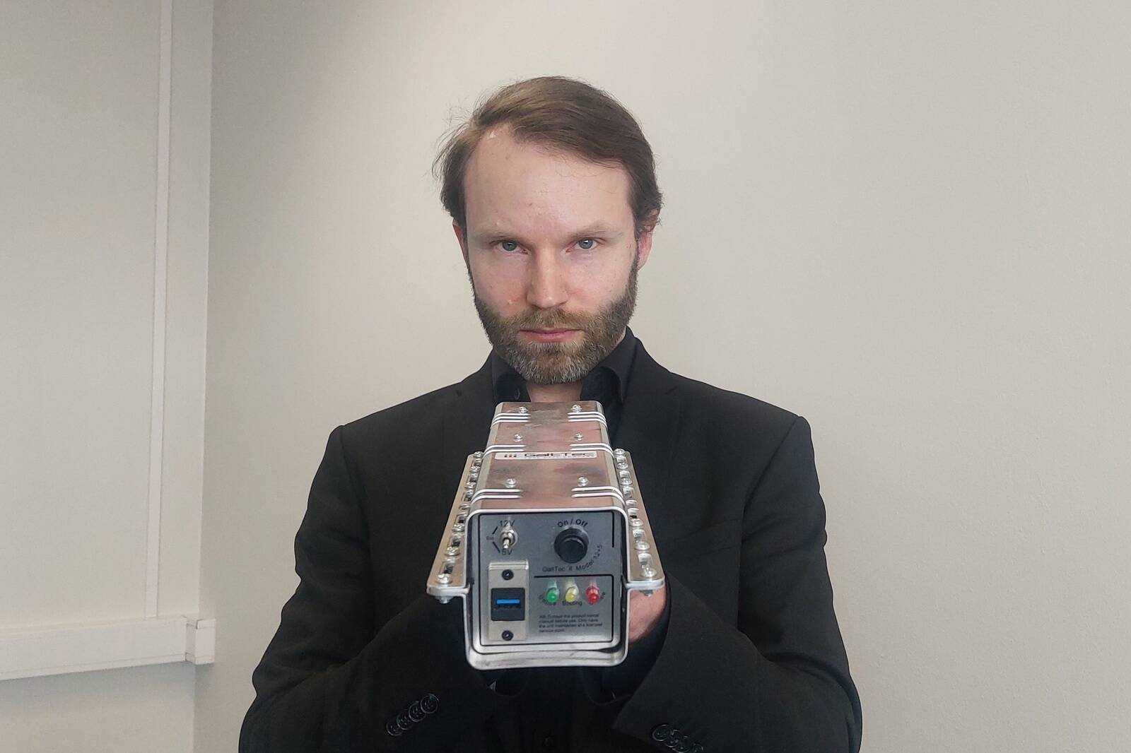CEO Glen Gelp holding a mockup of GaltTec's power source